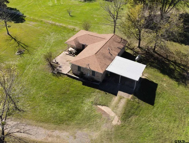 swimming pool view with a seating space