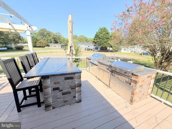 a view of a swimming pool with outdoor seating and city view