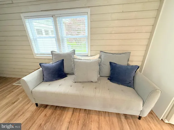 a large white bed sitting in a small room