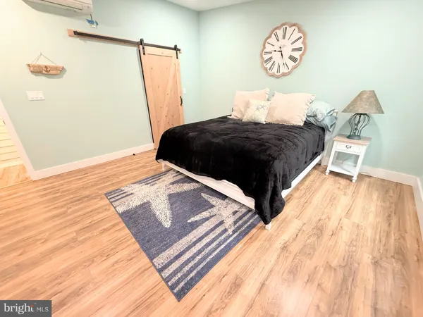 a bedroom with a bed and a table in it