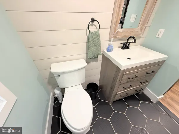a bathroom with a toilet and a sink