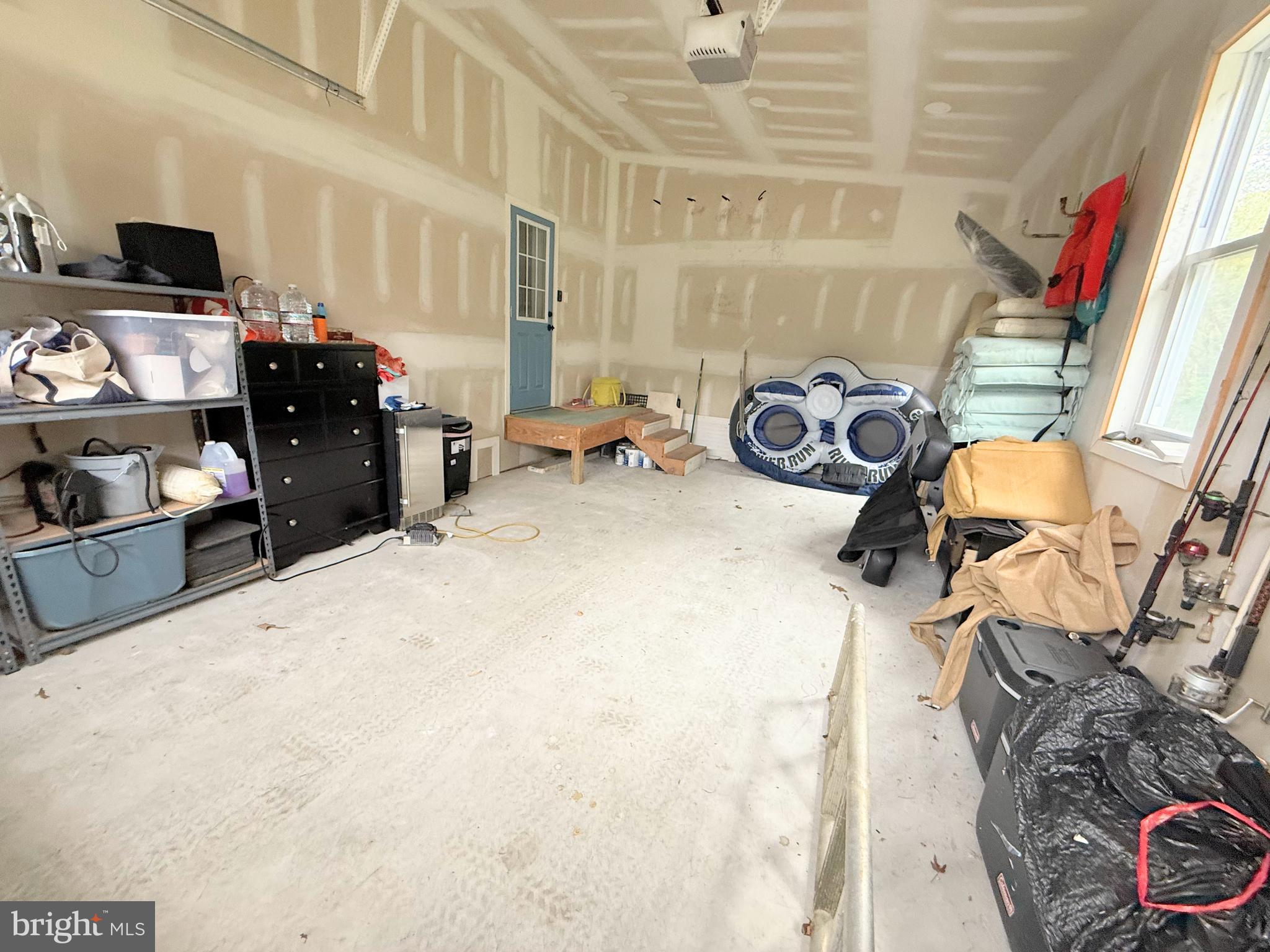 34635 Deck Street, Unit E323 Long Neck, DE 19966 - Photo 41 of 44 a view of a livingroom with furniture and a window