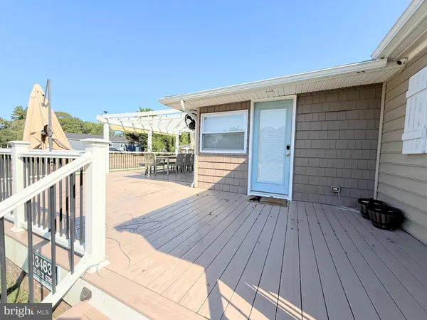 a view of outdoor space with wooden floor and seating