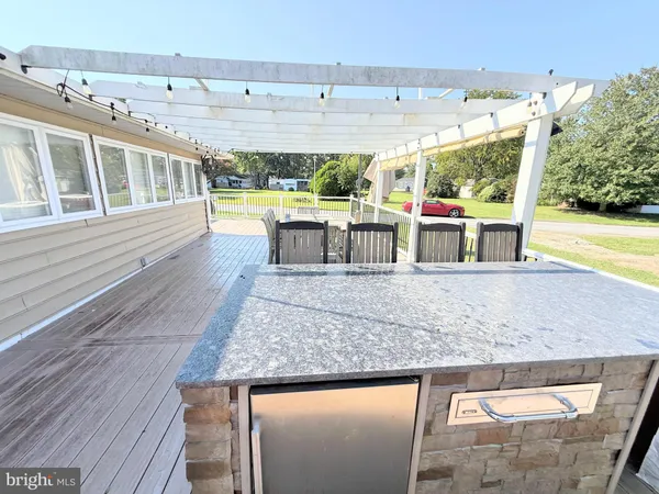 a view of swimming pool with outdoor seating and city view