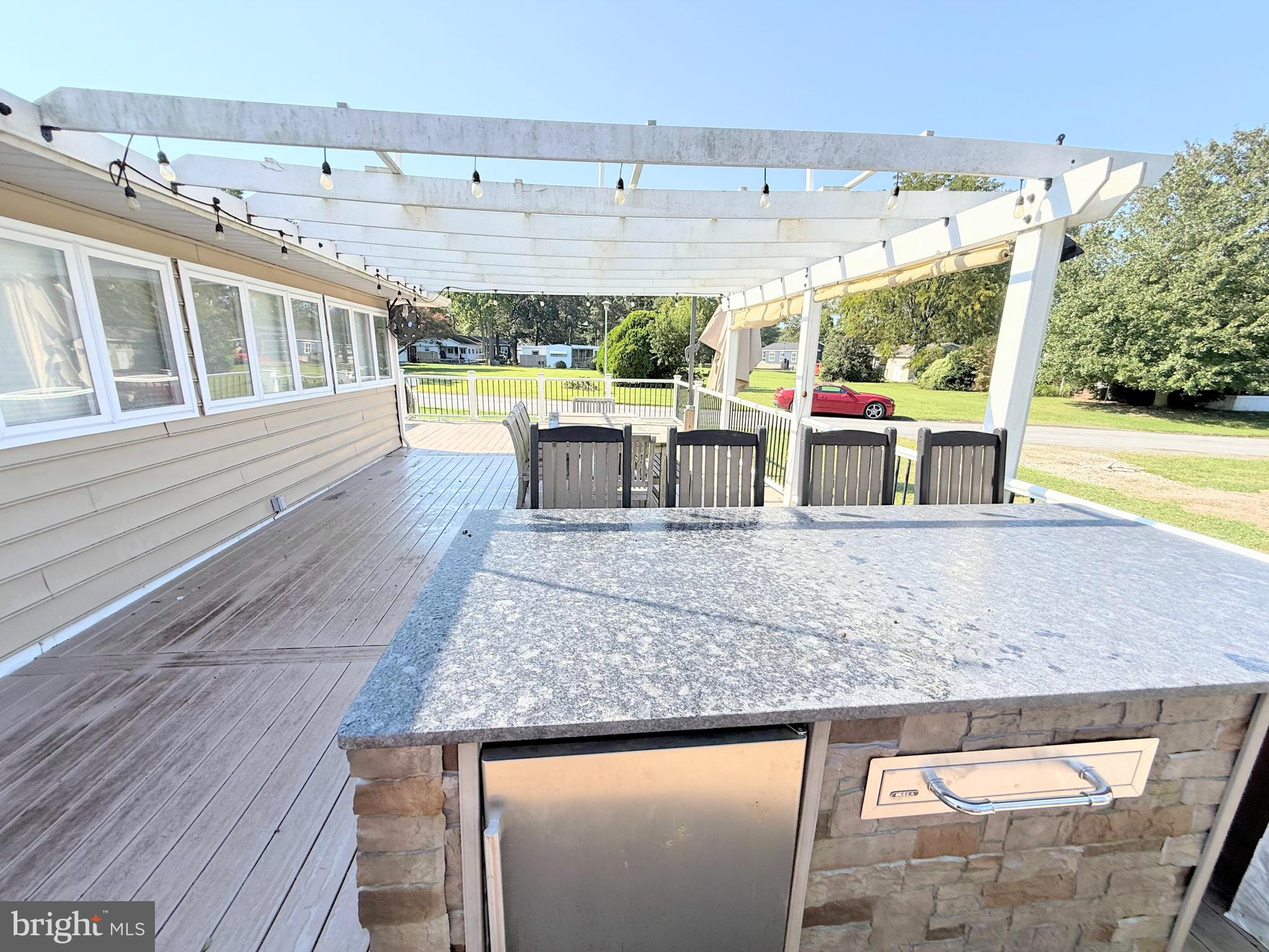 34635 Deck Street, Unit E323 Long Neck, DE 19966 - Photo 9 of 44 a view of swimming pool with outdoor seating and city view