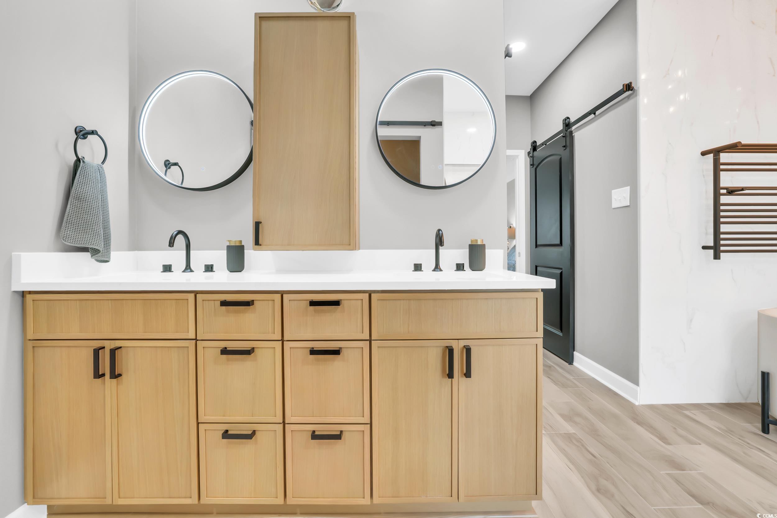 1705 Brookshade Court Conway, SC 29526 - Photo 22 of 40 Bathroom with double vanity and light wood finished floors