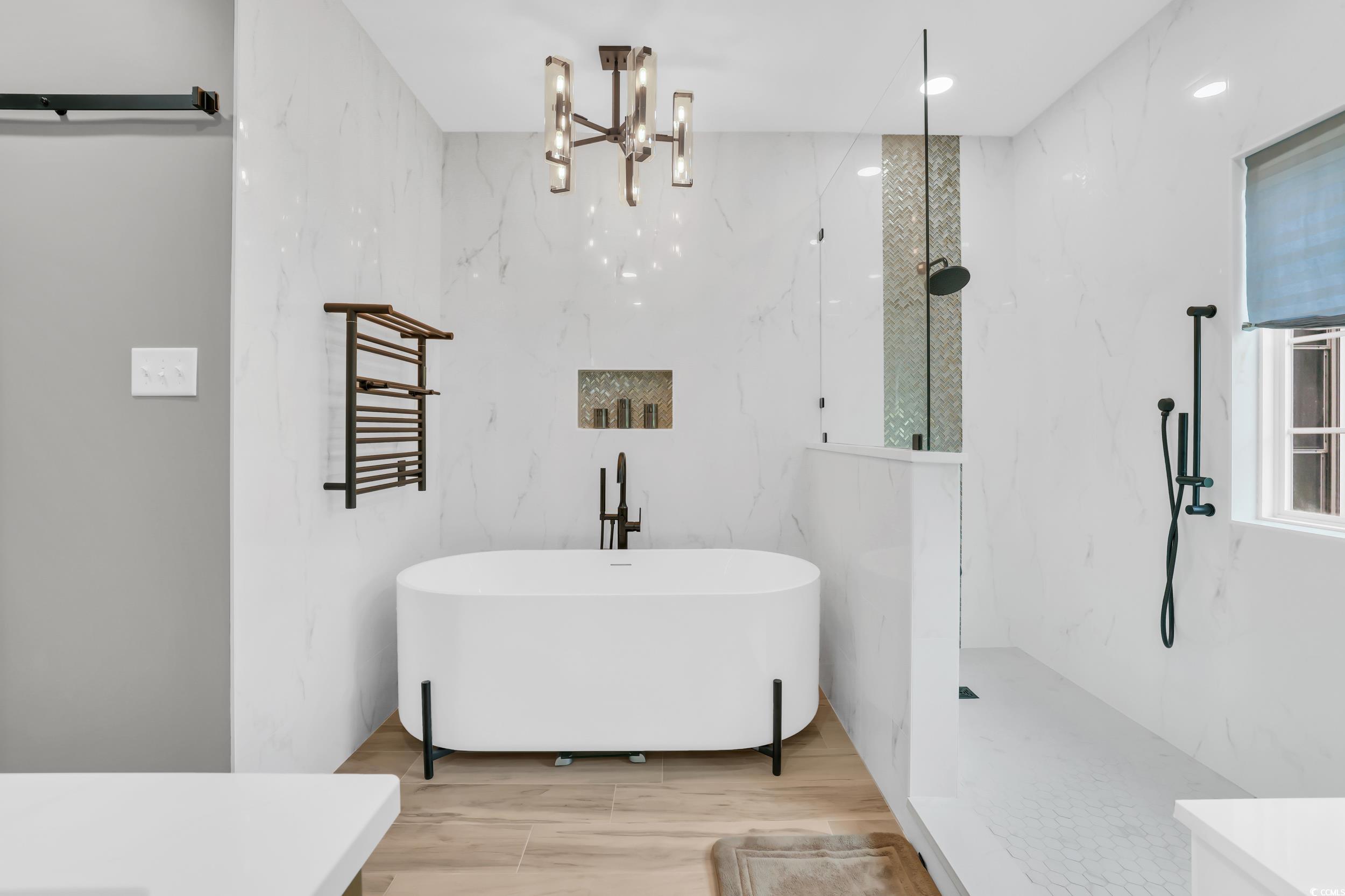 1705 Brookshade Court Conway, SC 29526 - Photo 23 of 40 Full bath featuring a freestanding bath, a marble finish shower, recessed lighting, a towel warming rack, and a chandelier
