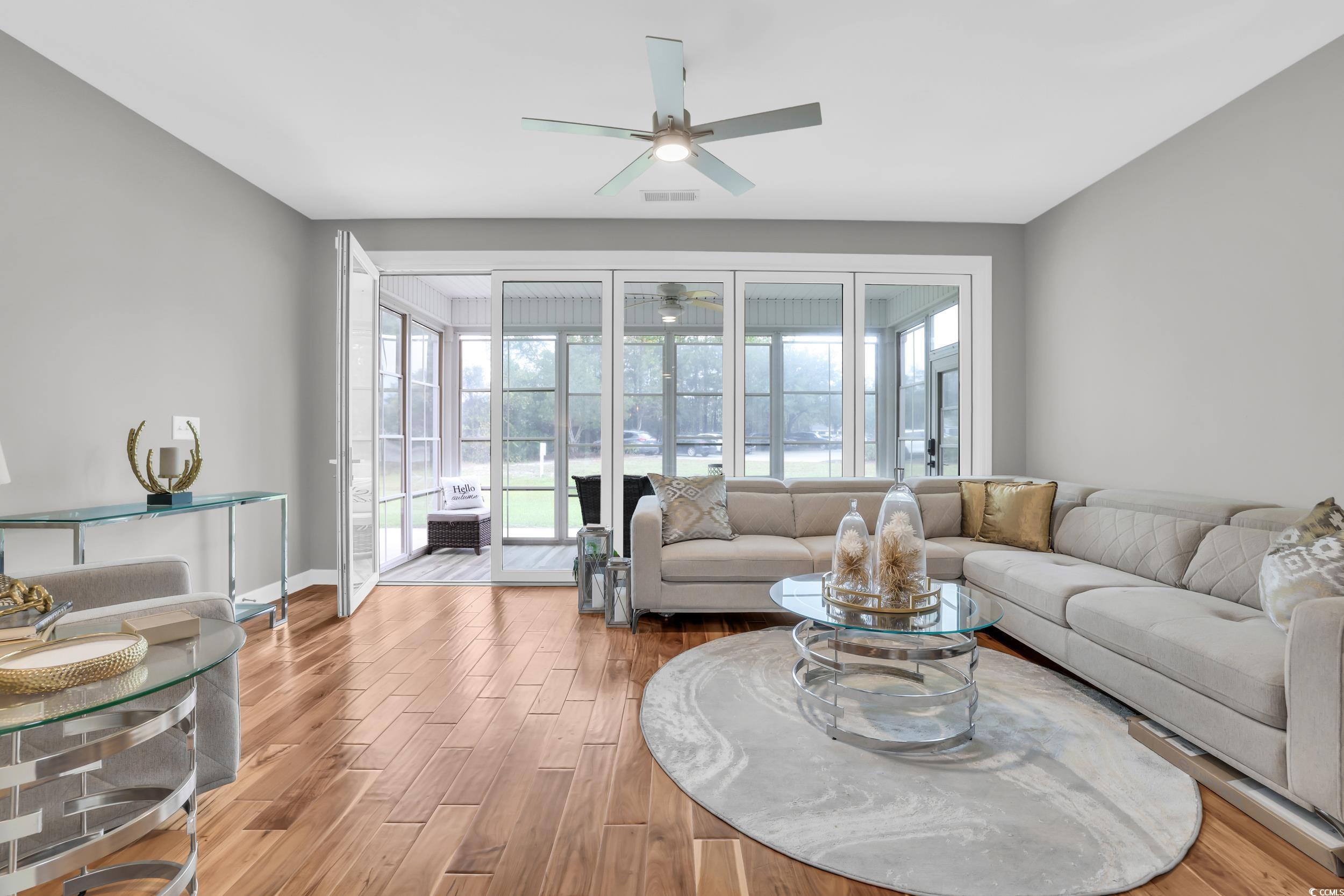 1705 Brookshade Court Conway, SC 29526 - Photo 29 of 40 Living area with wood finished floors and ceiling fan
