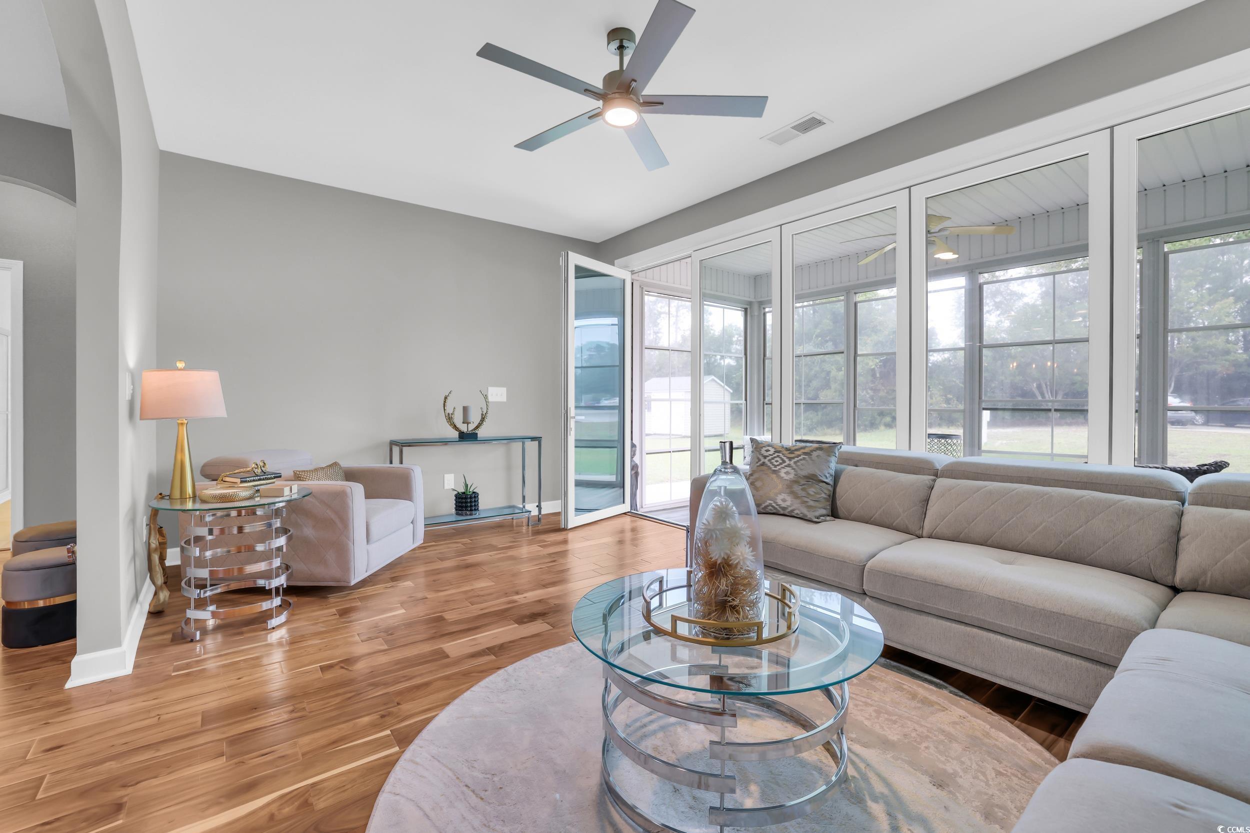 1705 Brookshade Court Conway, SC 29526 - Photo 30 of 40 Living area with plenty of natural light, light wood-type flooring, and a ceiling fan