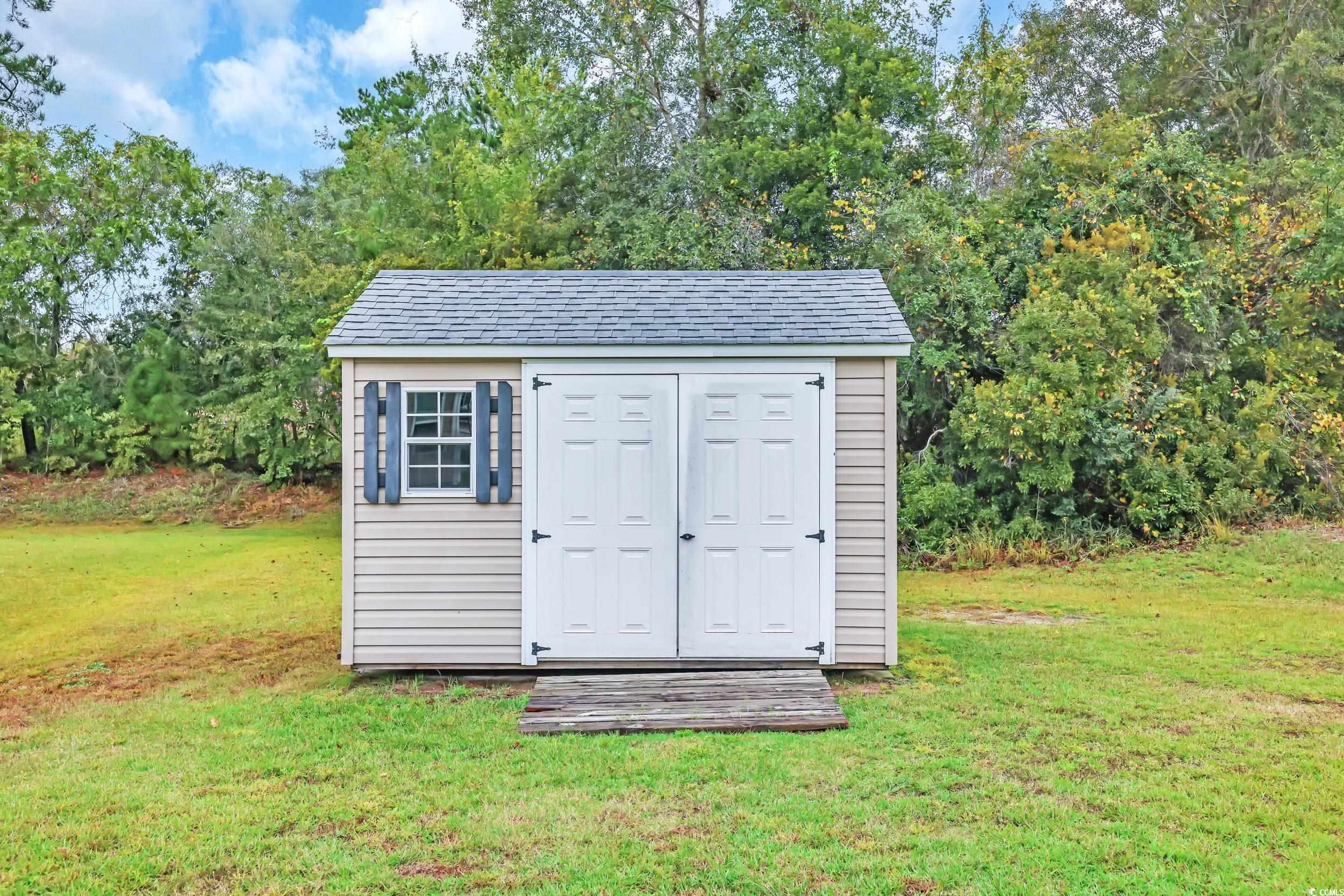 1705 Brookshade Court Conway, SC 29526 - Photo 35 of 40 View of shed featuring view of wooded area