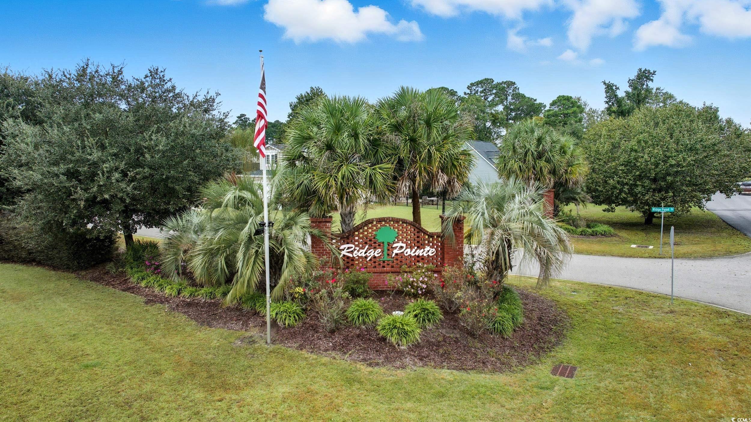 1705 Brookshade Court Conway, SC 29526 - Photo 39 of 40 Community sign with a lawn