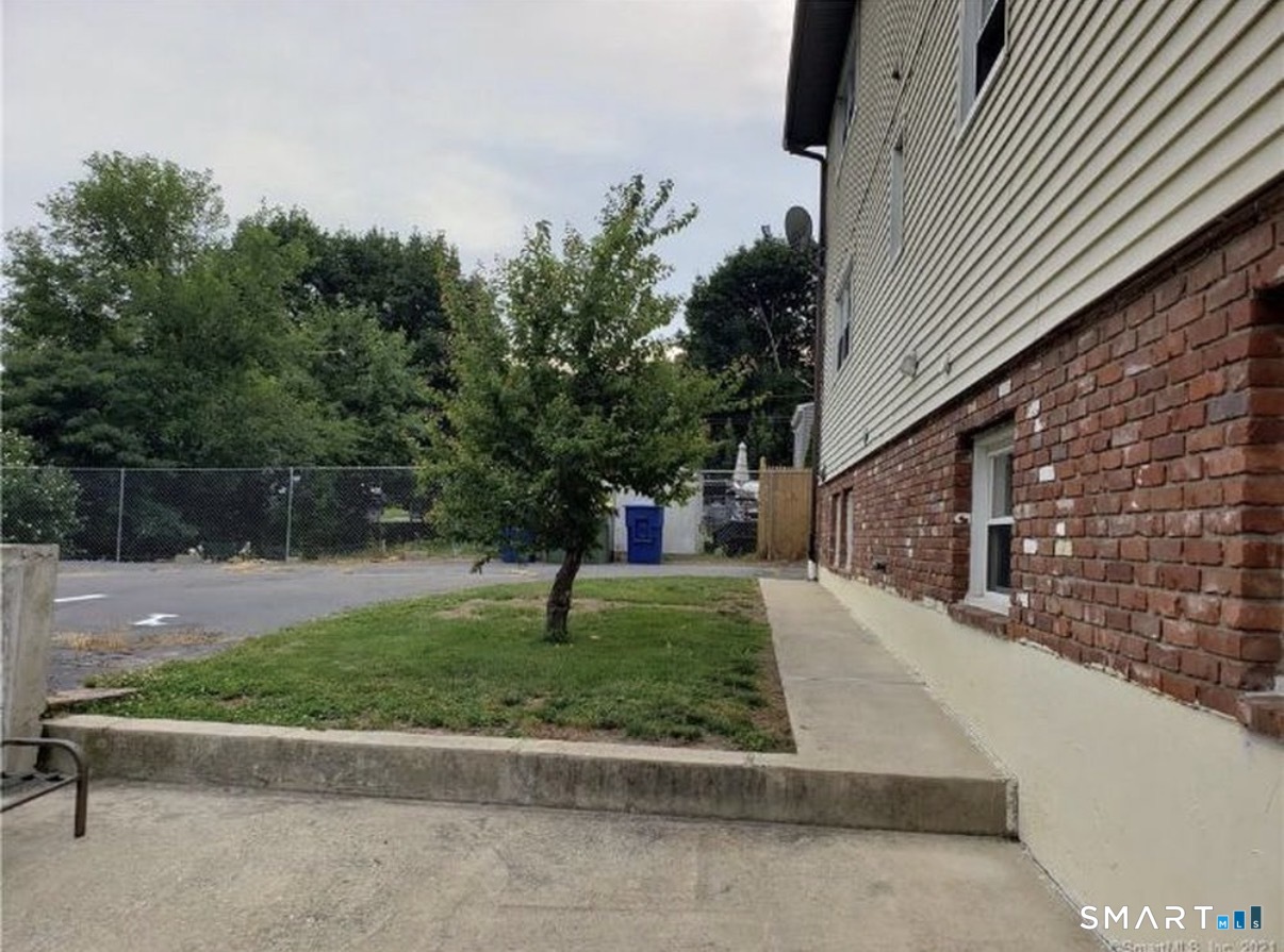 12 Hilltop Avenue, Unit 1 Waterbury, CT 06708 - Photo 7 of 7 a view of backyard with green space