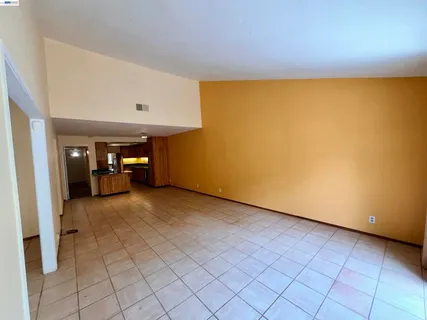 a kitchen with stainless steel appliances a stove a microwave and a sink