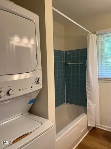 a bathroom with a tub and shower