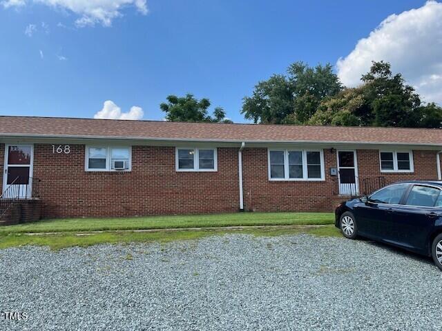 168 West Braxton Foushee Street, Unit 6 Carrboro, NC 27510 - Photo 14 of 14 a front view of a house with a garden