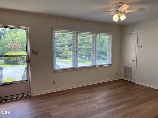168 West Braxton Foushee Street, Unit 6 Carrboro, NC 27510 - Photo 3 of 14 a view of an empty room with wooden floor and a window