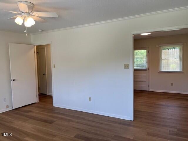 168 West Braxton Foushee Street, Unit 6 Carrboro, NC 27510 - Photo 4 of 14 an empty room with wooden floor chandelier fan and windows