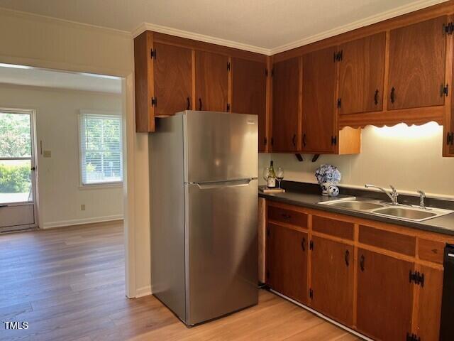 168 West Braxton Foushee Street, Unit 6 Carrboro, NC 27510 - Photo 5 of 14 a kitchen with a refrigerator and a sink