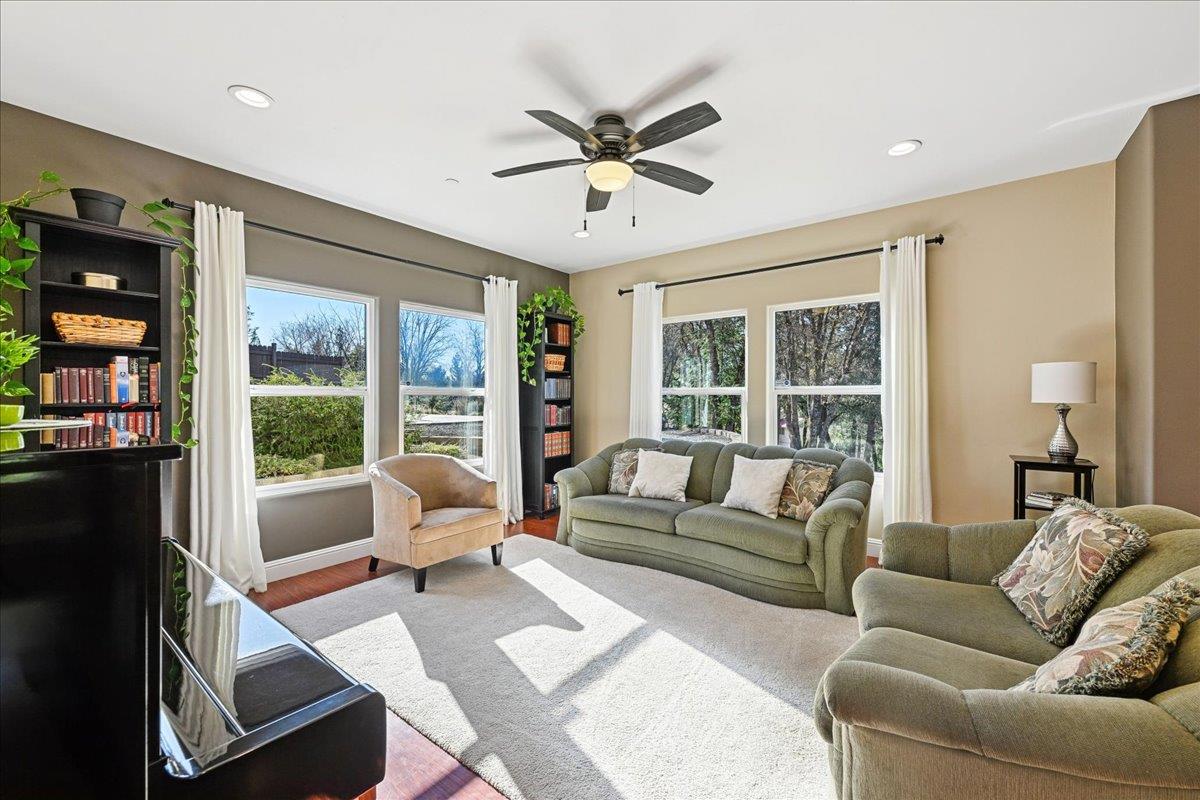 21895 One Fine Place Colfax, CA 95713 - Photo 18 of 82 a living room with furniture and a large window with garden view
