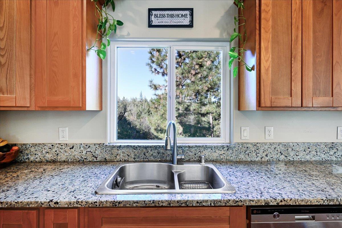 21895 One Fine Place Colfax, CA 95713 - Photo 24 of 82 a kitchen with granite countertop a sink and a granite counter top