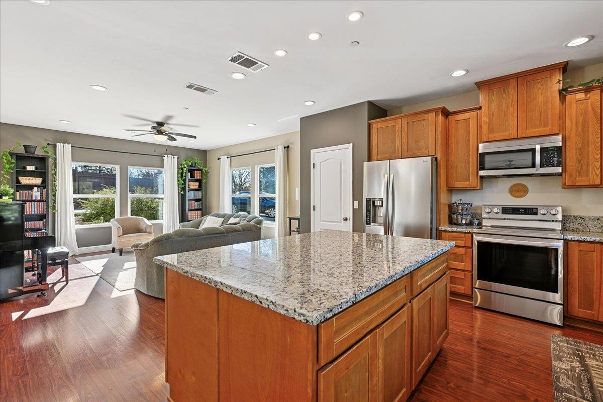 21895 One Fine Place Colfax, CA 95713 - Photo 26 of 81 a kitchen with stainless steel appliances granite countertop a sink a stove and a refrigerator
