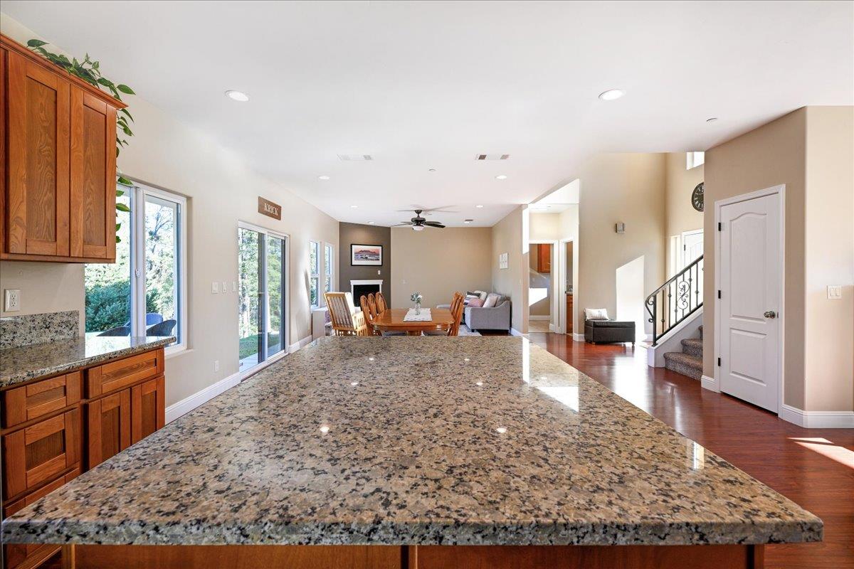 21895 One Fine Place Colfax, CA 95713 - Photo 27 of 81 a living room with stainless steel appliances granite countertop furniture wooden floor and a rug