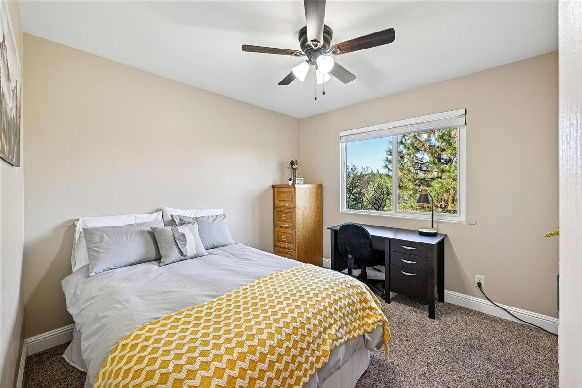 21895 One Fine Place Colfax, CA 95713 - Photo 34 of 82 a bedroom with a large bed and a window