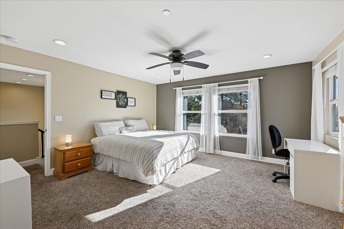 21895 One Fine Place Colfax, CA 95713 - Photo 42 of 81 a spacious bedroom with a large bed and a large window