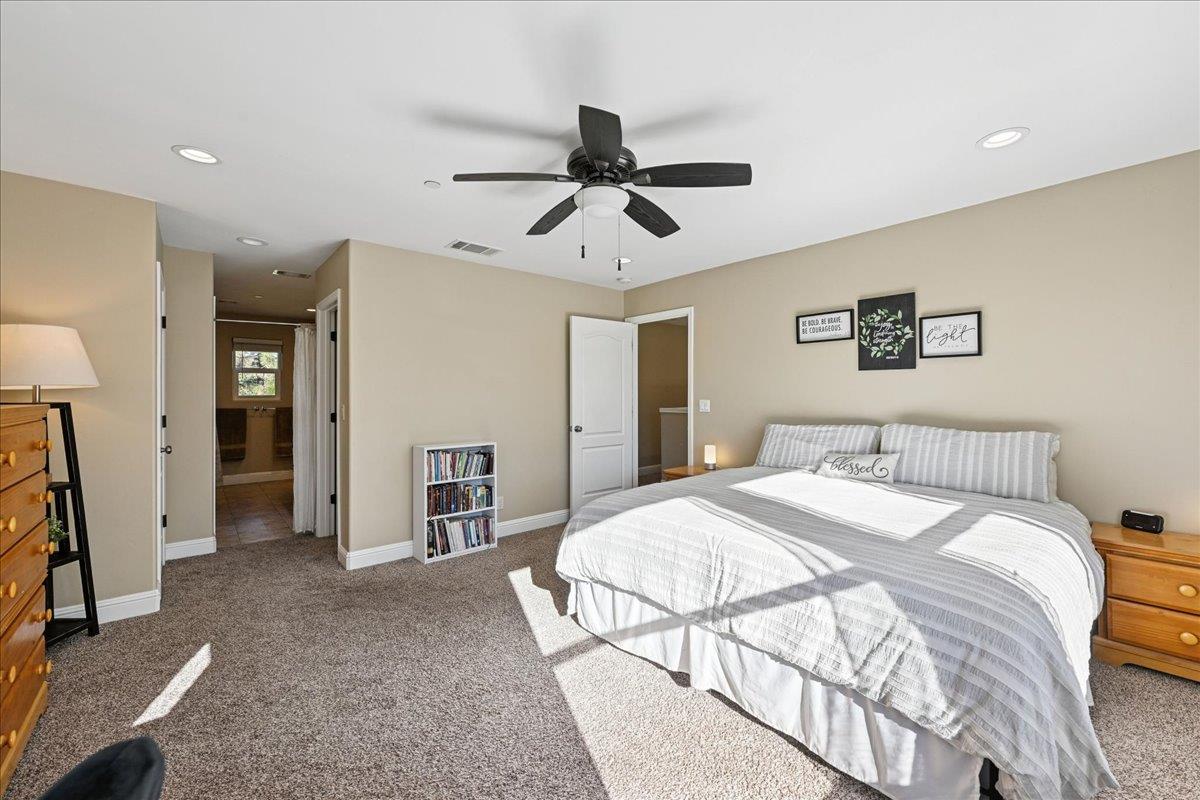 21895 One Fine Place Colfax, CA 95713 - Photo 44 of 82 a spacious bedroom with a bed and a walk in closet