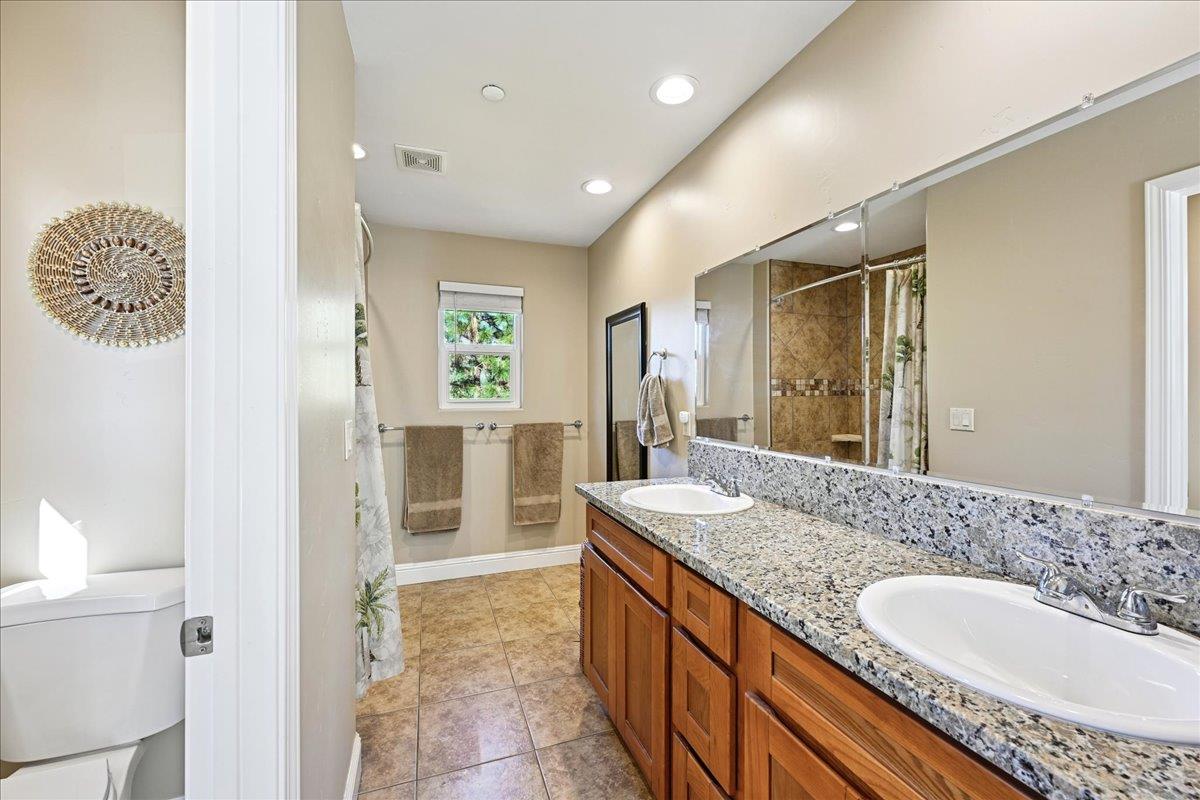 21895 One Fine Place Colfax, CA 95713 - Photo 45 of 81 a spacious bathroom with a granite countertop sink and a mirror