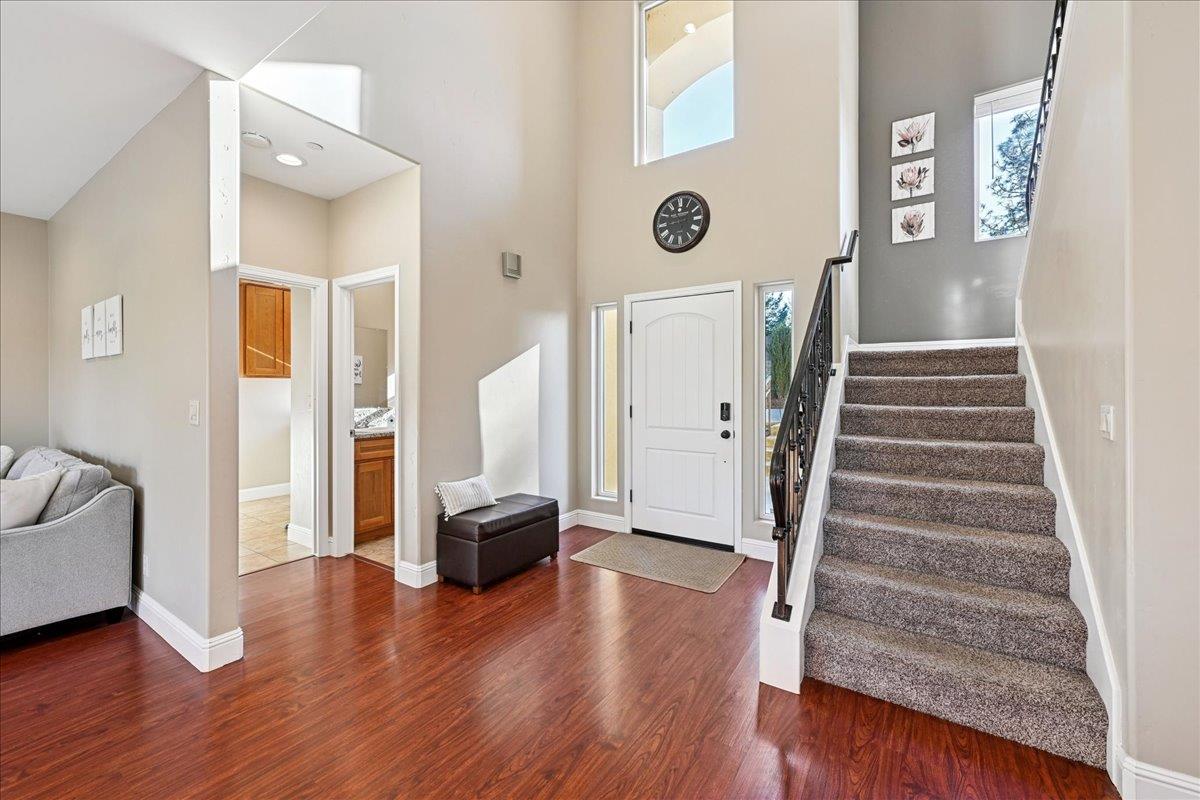 21895 One Fine Place Colfax, CA 95713 - Photo 7 of 82 a view of a hallway with wooden floor and staircase