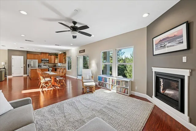 a dining room with furniture and wooden floor