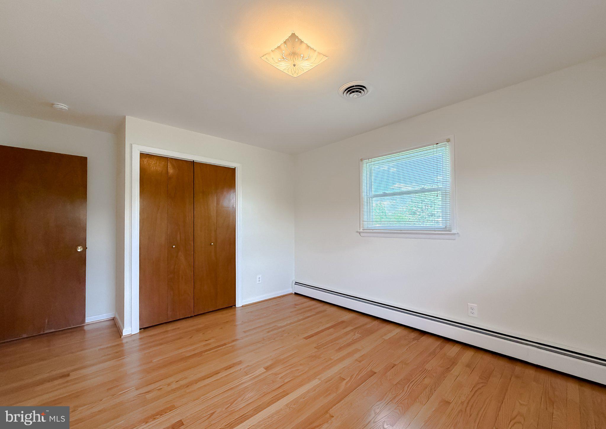 23230 Colton Point Road Avenue, MD 20609 - Photo 32 of 63 Bright and airy room with hardwood floors.