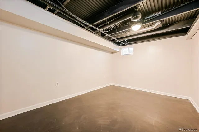 a view of a house with a yard and wooden fence