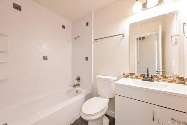 a picture of a bathroom with a picture of a wall