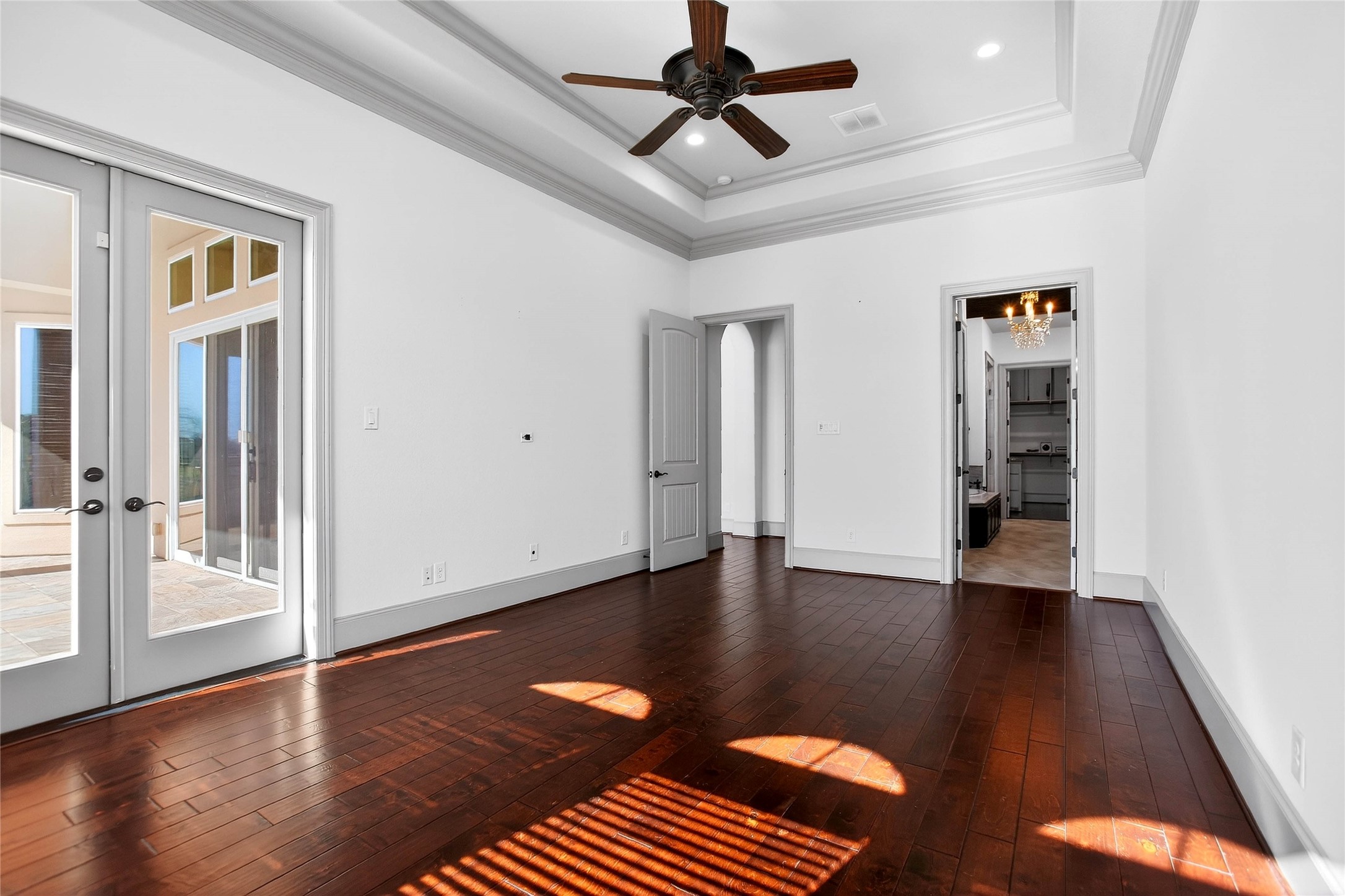 12349 Tramonto Conroe, TX 77304 - Photo 20 of 50 a view of an empty room with wooden floor and a window