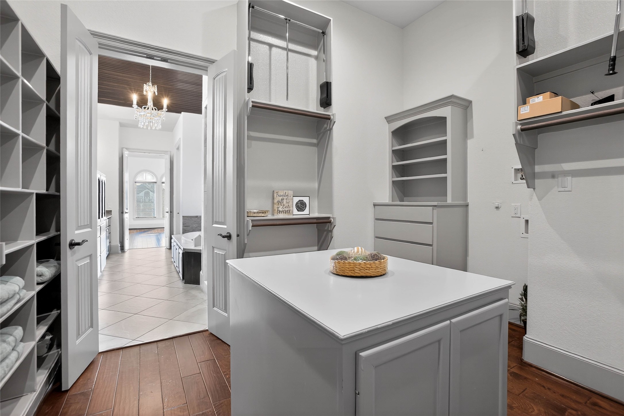 12349 Tramonto Conroe, TX 77304 - Photo 24 of 50 a kitchen with a sink a refrigerator and wooden floor