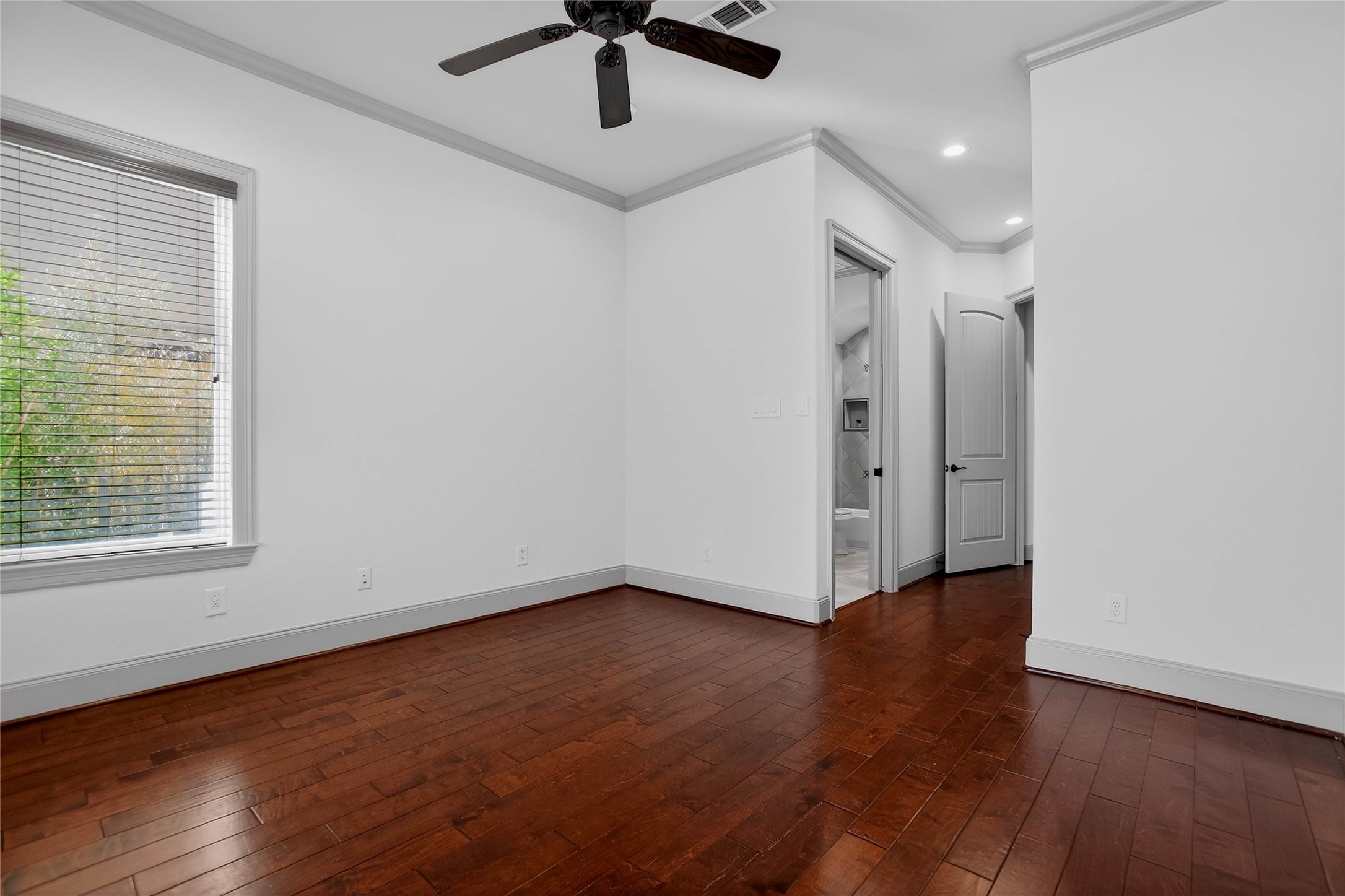 12349 Tramonto Conroe, TX 77304 - Photo 33 of 50 an empty room with wooden floor and windows
