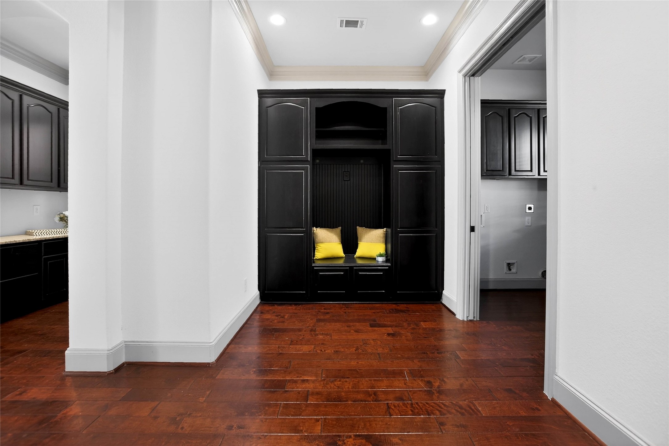 12349 Tramonto Conroe, TX 77304 - Photo 36 of 50 a view of a hallway with wooden floor and a kitchen