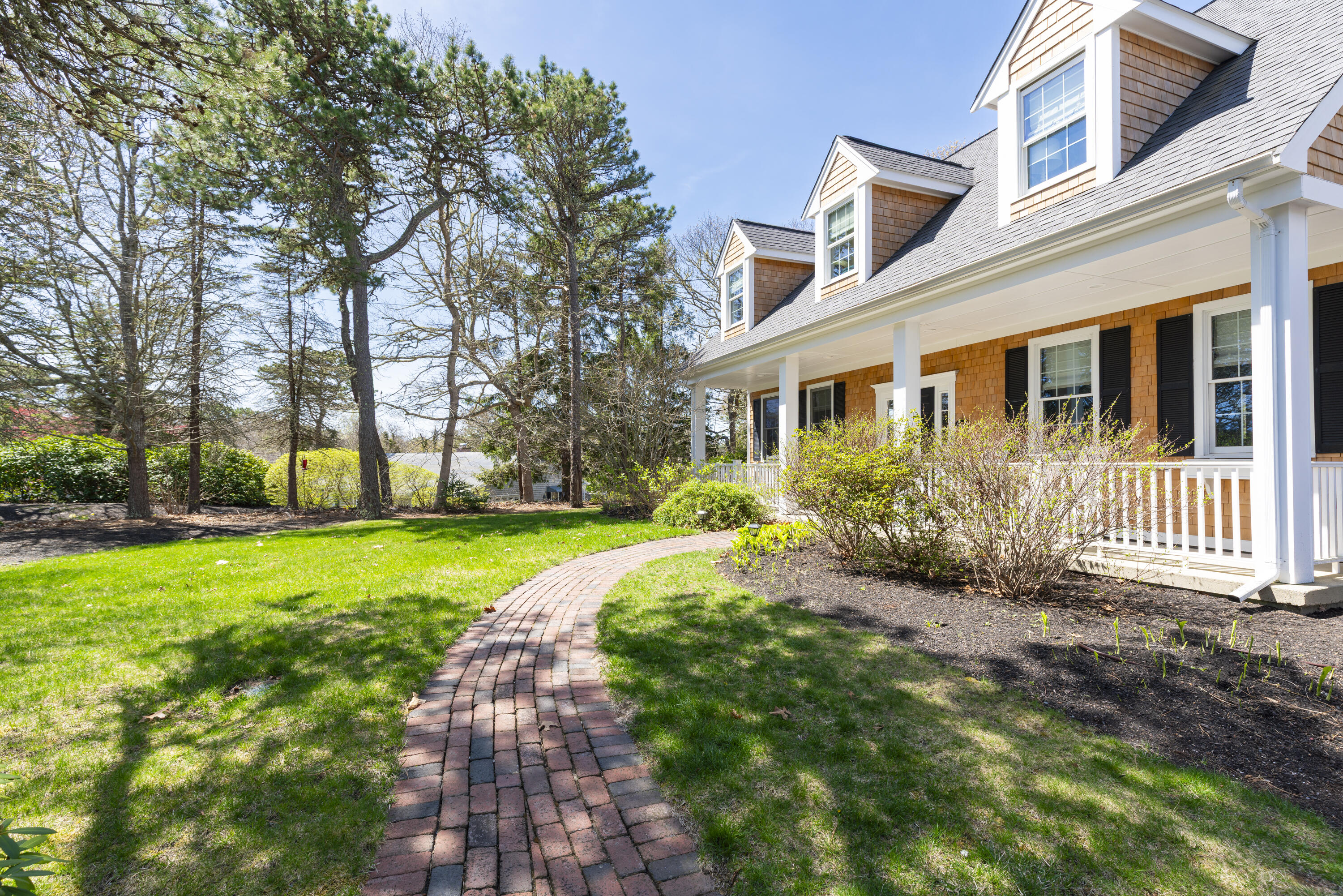 331 Riverview Drive Chatham, MA 02633 - Photo 11 of 50 a front view of a house with garden