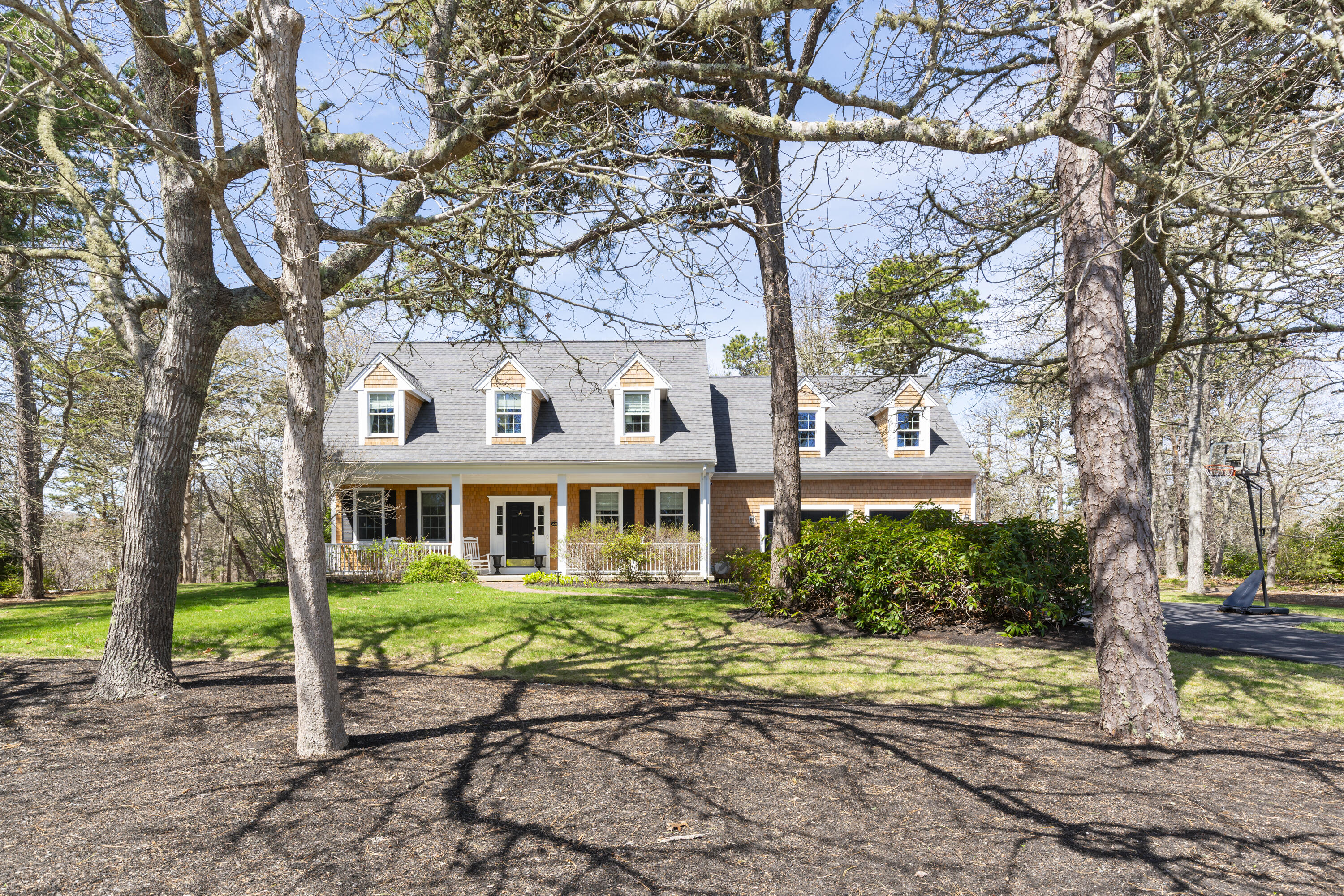 331 Riverview Drive Chatham, MA 02633 - Photo 12 of 50 a house that has a tree in front of it