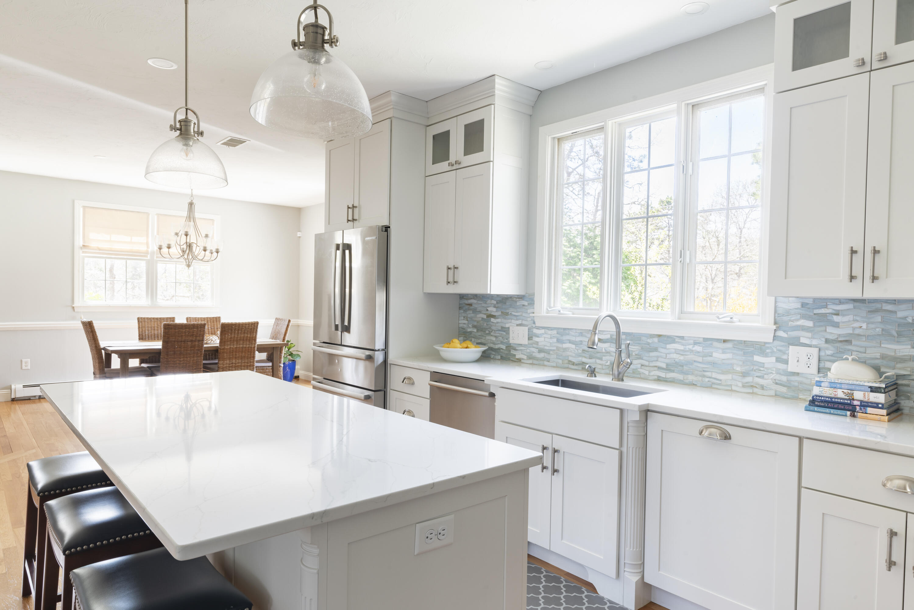331 Riverview Drive Chatham, MA 02633 - Photo 15 of 50 a kitchen with a sink a center island cabinets and a window
