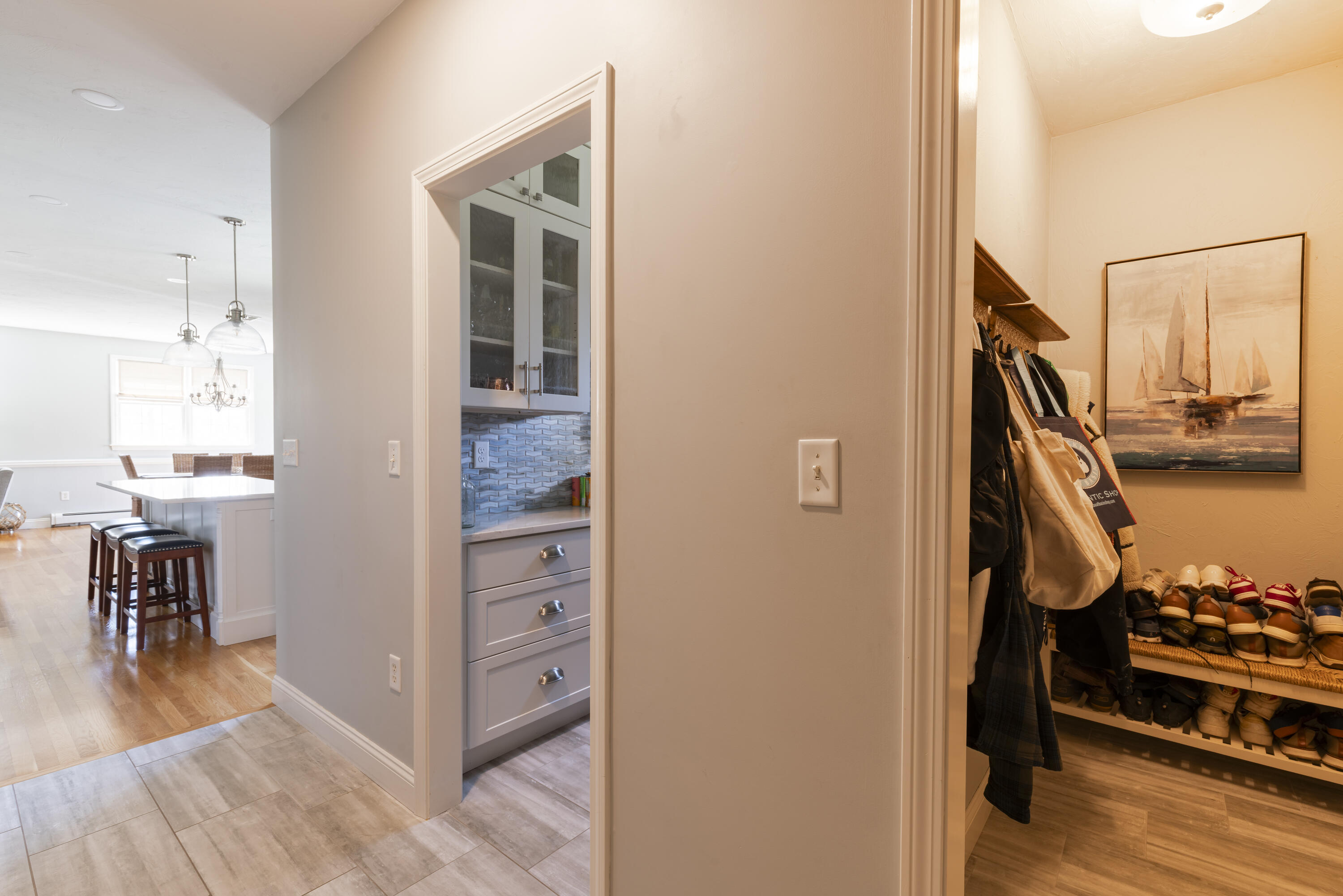 331 Riverview Drive Chatham, MA 02633 - Photo 17 of 50 a view of a hallway with wooden floor and a living room