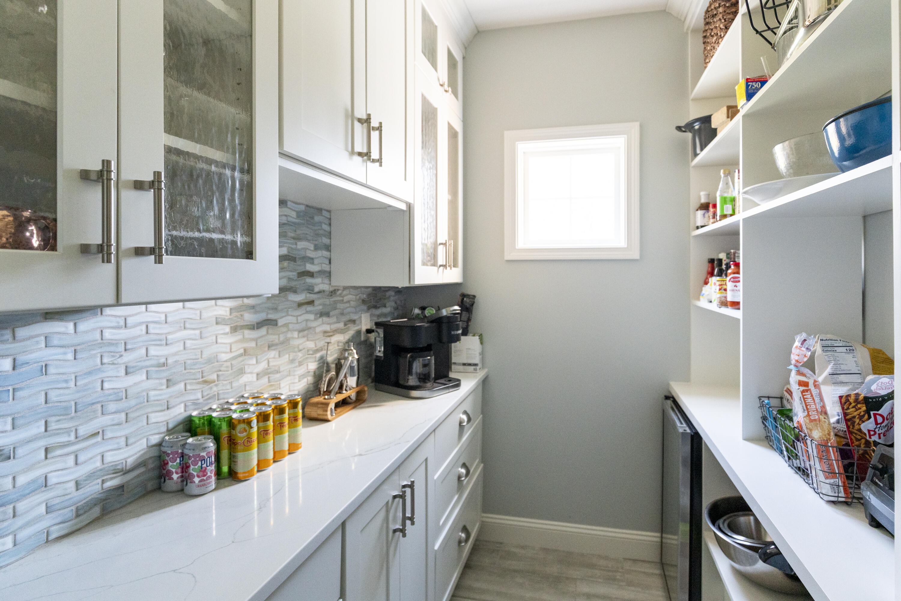 331 Riverview Drive Chatham, MA 02633 - Photo 18 of 50 a kitchen with a sink a stove and cabinets