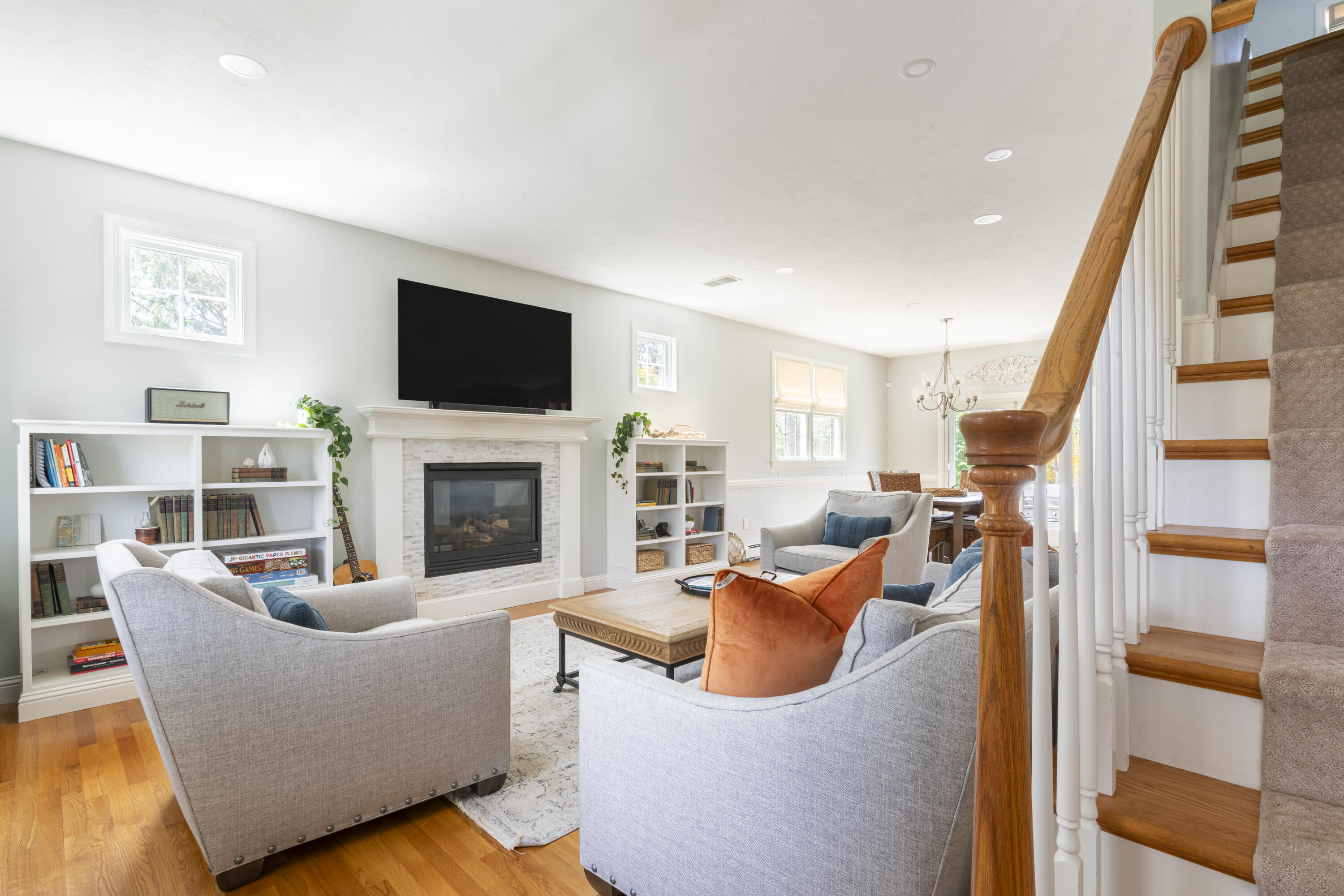 331 Riverview Drive Chatham, MA 02633 - Photo 24 of 50 a living room with furniture a flat screen tv and a fireplace