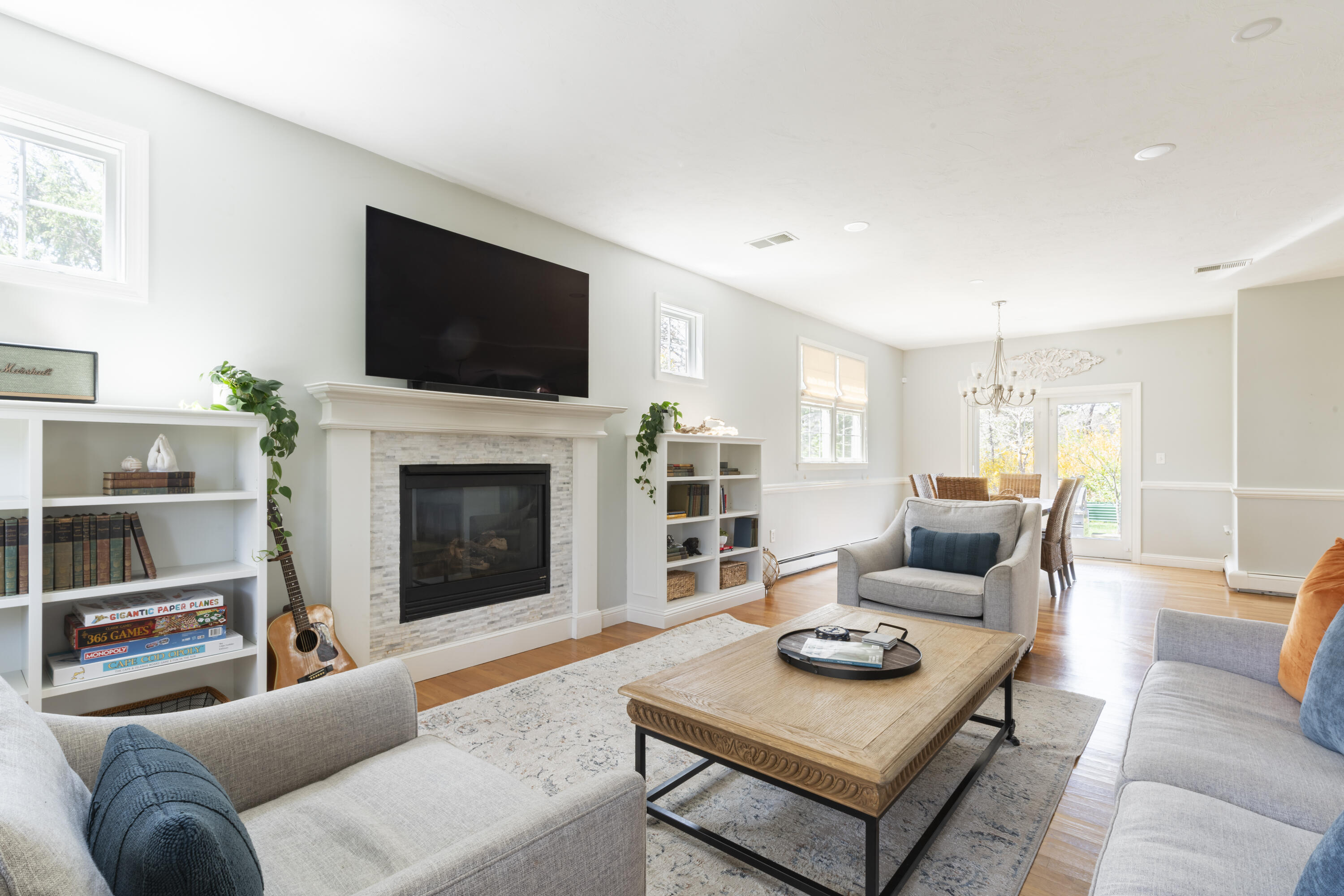 331 Riverview Drive Chatham, MA 02633 - Photo 26 of 50 a living room with furniture a flat screen tv and a fireplace