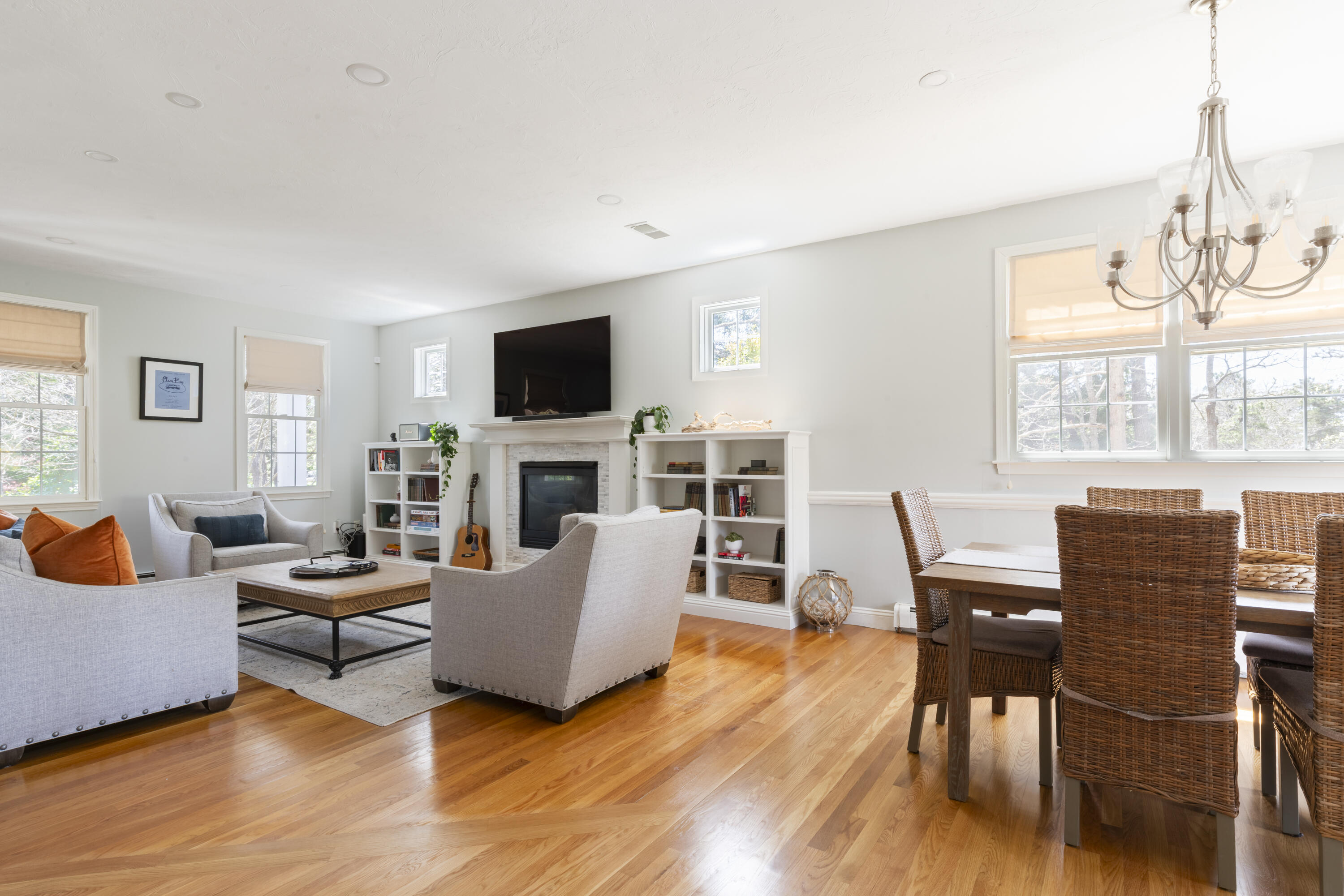 331 Riverview Drive Chatham, MA 02633 - Photo 28 of 50 a living room with furniture a fireplace and a flat screen tv
