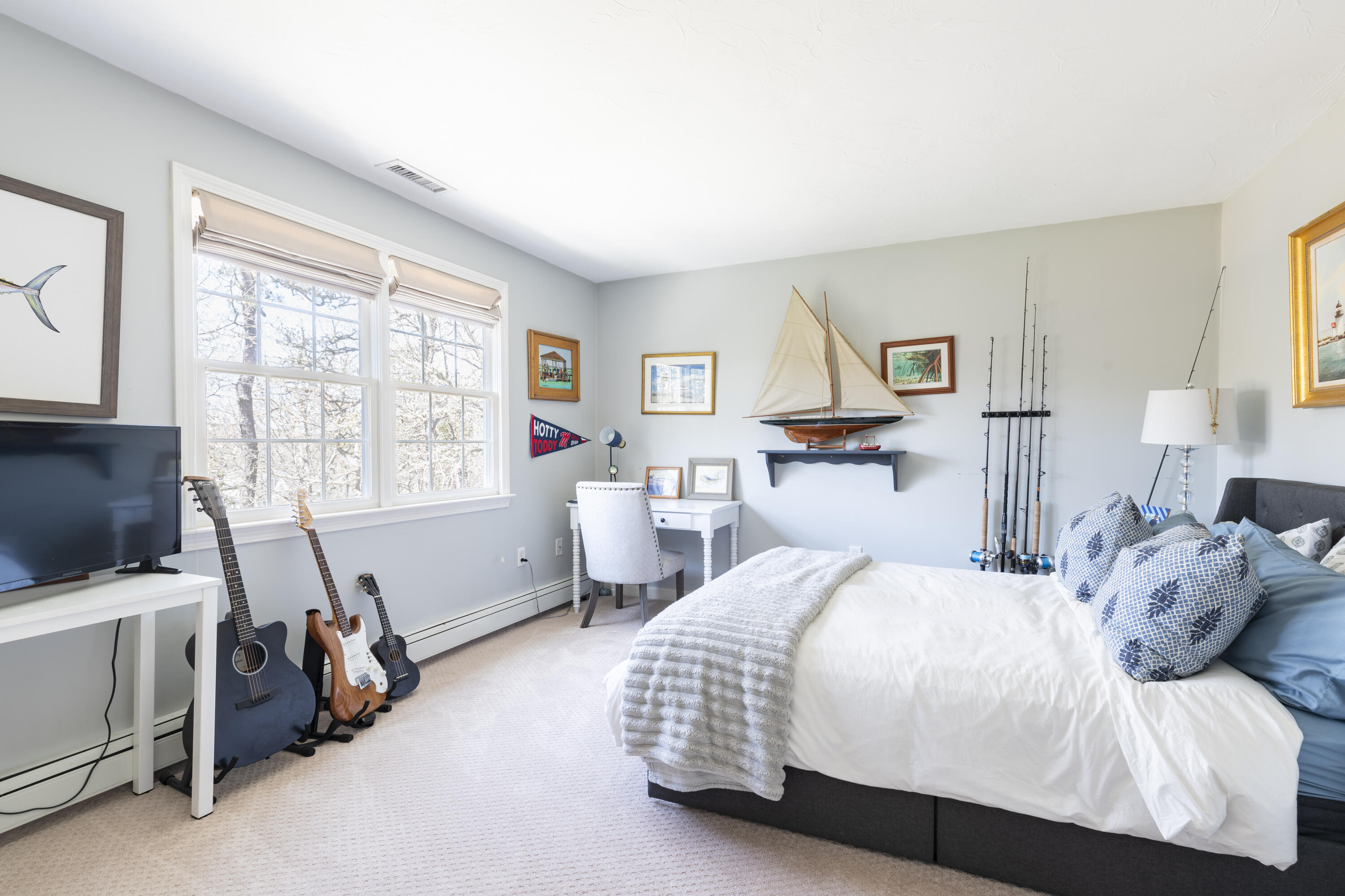 331 Riverview Drive Chatham, MA 02633 - Photo 37 of 50 a bedroom with a bed and a flat screen tv