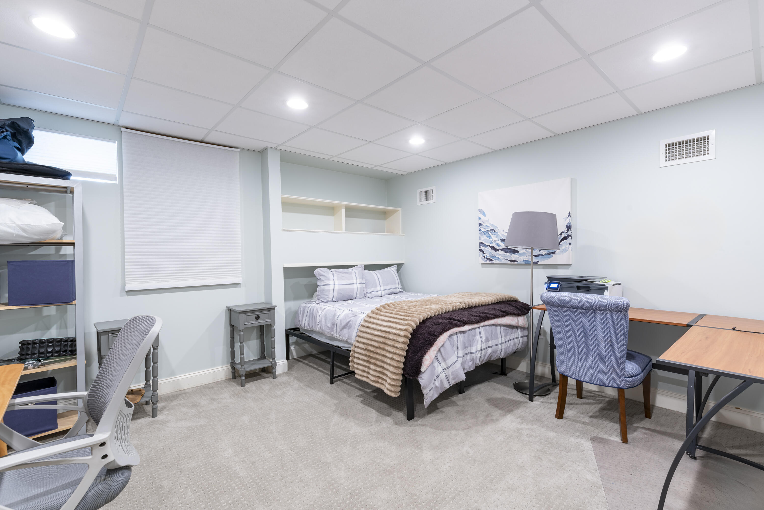 331 Riverview Drive Chatham, MA 02633 - Photo 45 of 50 a bedroom with a bed a table and a bookshelf