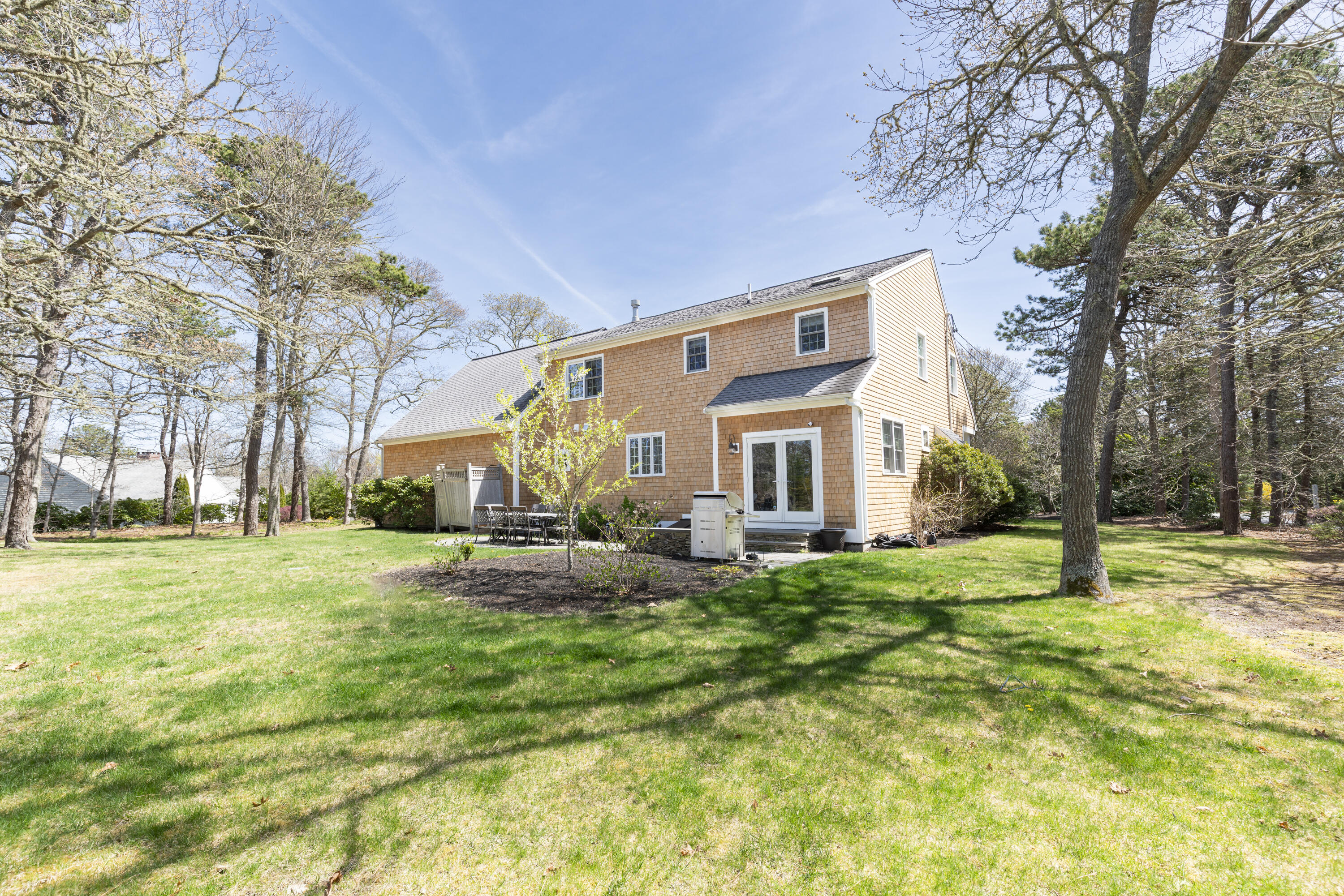331 Riverview Drive Chatham, MA 02633 - Photo 48 of 50 a view of a house with a yard
